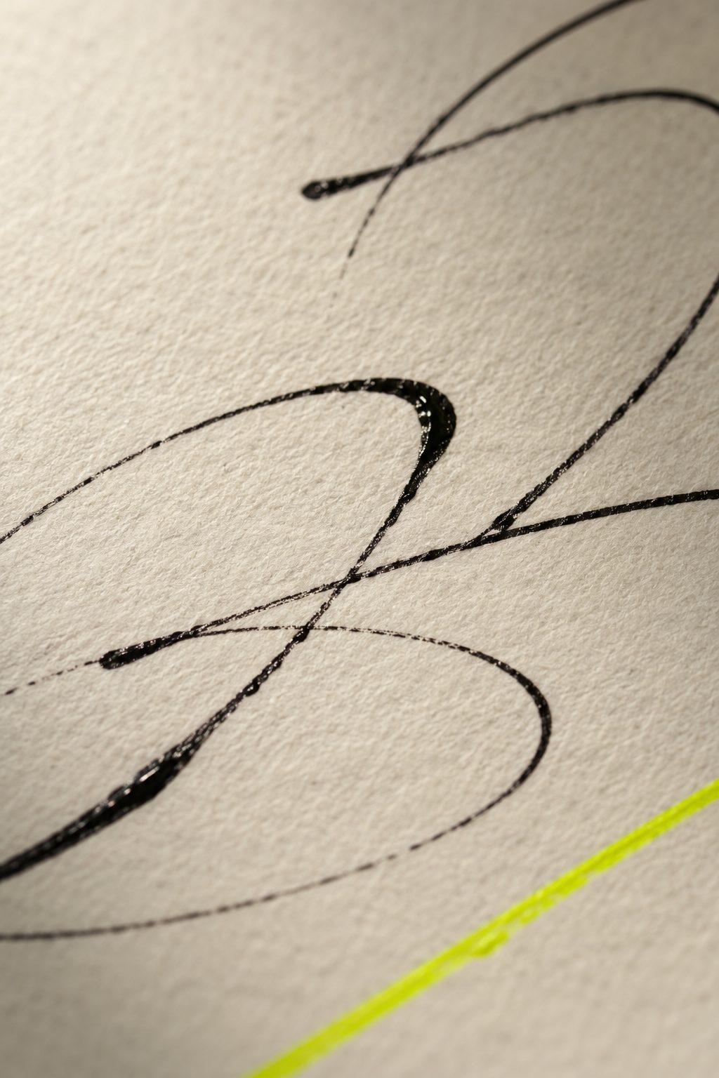Signature ink on paper, with a lime line